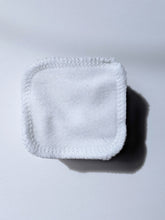Load image into Gallery viewer, a stack of white cotton reusable facial rounds
