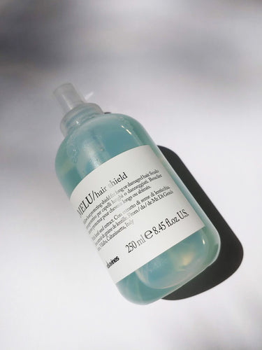a bottle of MELU hair shield by Davines - the bottle has a spray nozzle