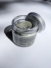 Load image into Gallery viewer, a small jar of cream deodorant. It is in a glass jar with a tin lid.
