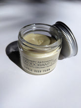 Load image into Gallery viewer, a small jar of cream deodorant. It is in a glass jar with a tin lid.