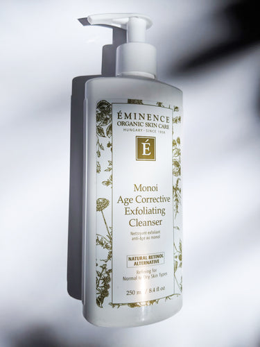 a bottle of monoi age corrective exfoliating cleanser