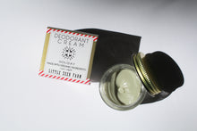Load image into Gallery viewer, a small jar of cream deodorant. It is in a glass jar with a tin lid. it is next to the box it comes in that says "Deodorant cream - holiday. made with organic ingredients."
