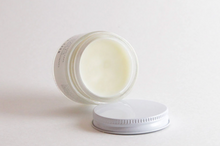 Load image into Gallery viewer, an open jar of booty balm by Little Seed Farm
