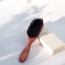 Load image into Gallery viewer, a wooden brush with boar bristles