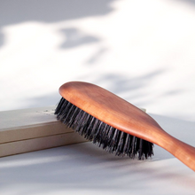 Load image into Gallery viewer, a wooden brush with boar bristles