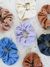 Load image into Gallery viewer, multiple gauze scrunchies laying next to each other varying in color