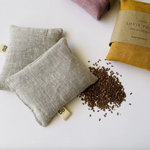 Load image into Gallery viewer, several linen pillows laying down with flaxseed