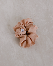 Load image into Gallery viewer, a close up of a rose colored scrunchie