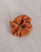 Load image into Gallery viewer, a close up of an orange scrunchie
