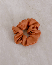 Load image into Gallery viewer, a close up of an orange scrunchie
