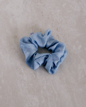 Load image into Gallery viewer, a close up of a light blue colored scrunchie