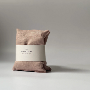a rose colored linen stress relief pillow
