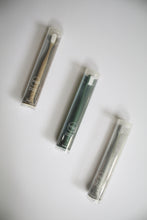 Load image into Gallery viewer, three biodegradable toothbrushes - one tan, one green, and one off white