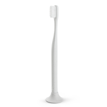 Load image into Gallery viewer, a closeup of the white biodegradable toothbrush mad of cotton