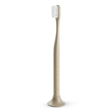 Load image into Gallery viewer, a close up of the tan biodegradable toothbrush made of flax