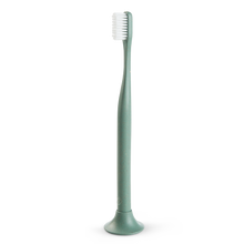 Load image into Gallery viewer, a close up of the green biodegradable toothbrush made of hemp