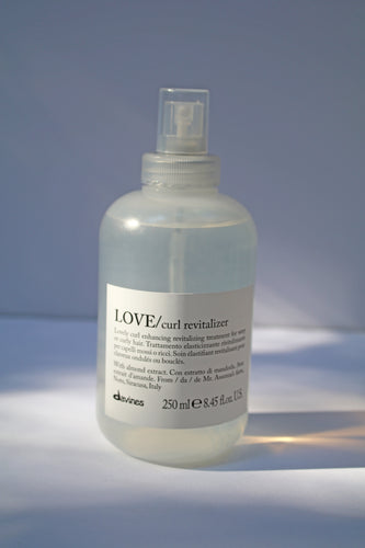 a bottle of LOVE curl revitalizer by Davines