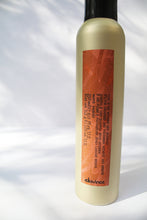 Load image into Gallery viewer, a close up of a golden can of dry shampoo by Davines with an orange label