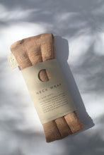 Load image into Gallery viewer, a peach and cream colored neck wrap