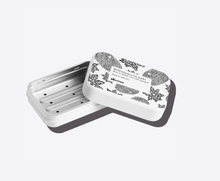 Load image into Gallery viewer, the shampoo bar tin lid is open and resting on the bottom of the tin
