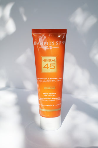 an orange tube of sunscreen