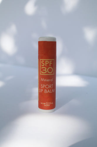 an orange tube of SPF lip balm