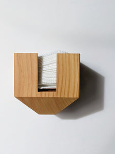 the front of the wooden container, with an opening in the front making the facial rounds easily accessible