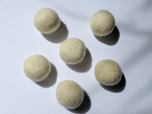 five of the white wool dryer balls