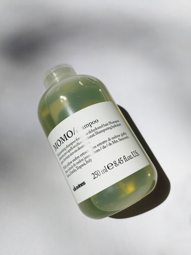 a bottle of MOMO shampoo by Davines