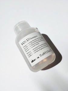 a small bottle of Volu shampoo by Davines