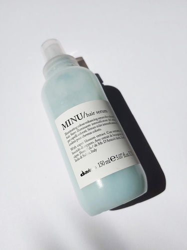 a bottle of MINU hair serum