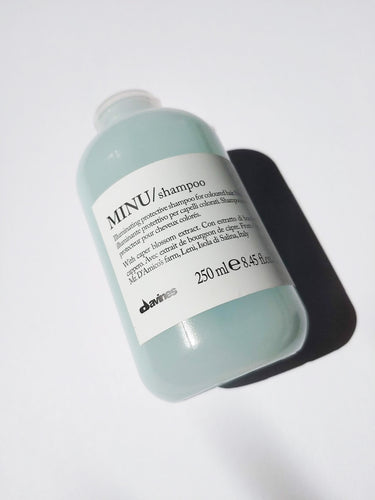 a bottle of MINU shampoo by Davines