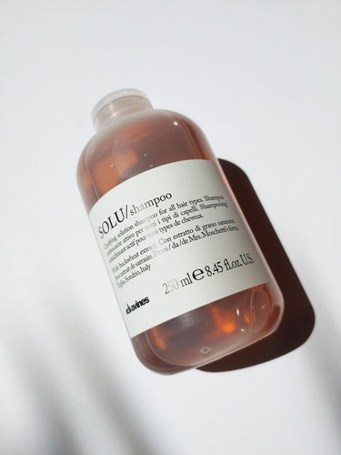 a bottle of solu shampoo by Davines