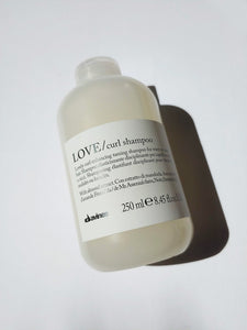 a bottle of LOVE curl shampoo by Davines