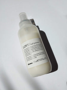 a bottle of LOVE curl primer by Davines