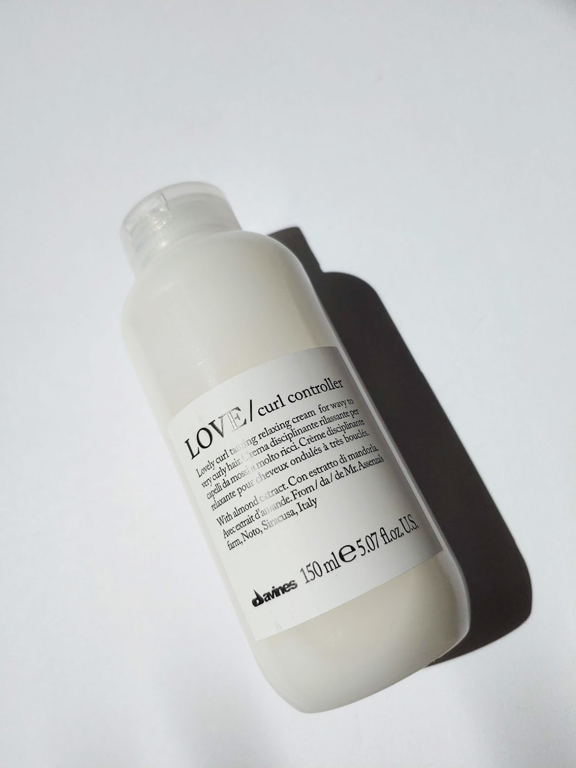 a bottle of LOVE curl controller by Davines