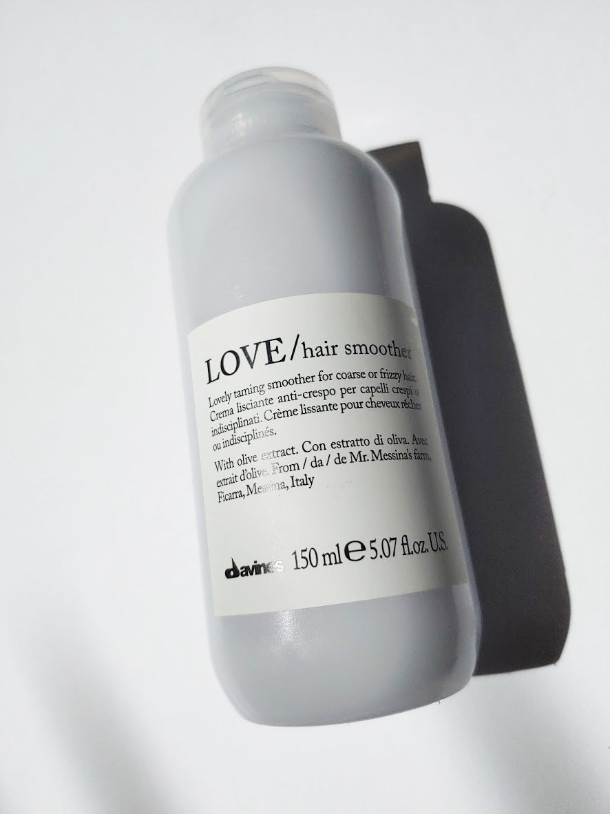a bottle of LOVE hair smoother by Davines