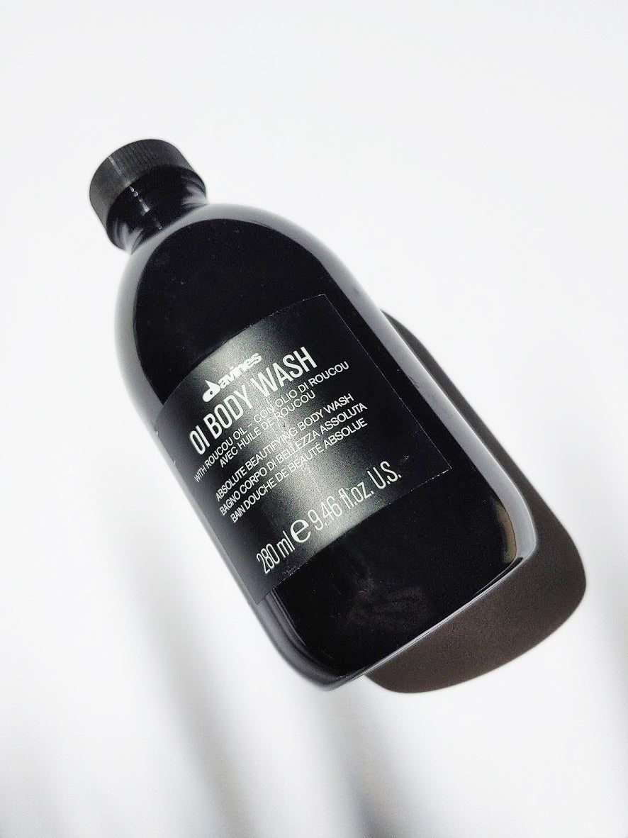 a bottle of oi body wash by Davines