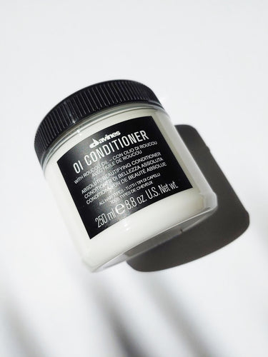 a jar of oi conditioner by Davines