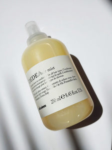 a spray bottle of Dede hair mist - it is yellow in color