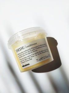 a small jar of the Dede conditioner by Davines - it is yellow in color