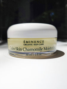 a jar of the calm skin chamomile moisturizer by Eminence. It is a short, wide jar.