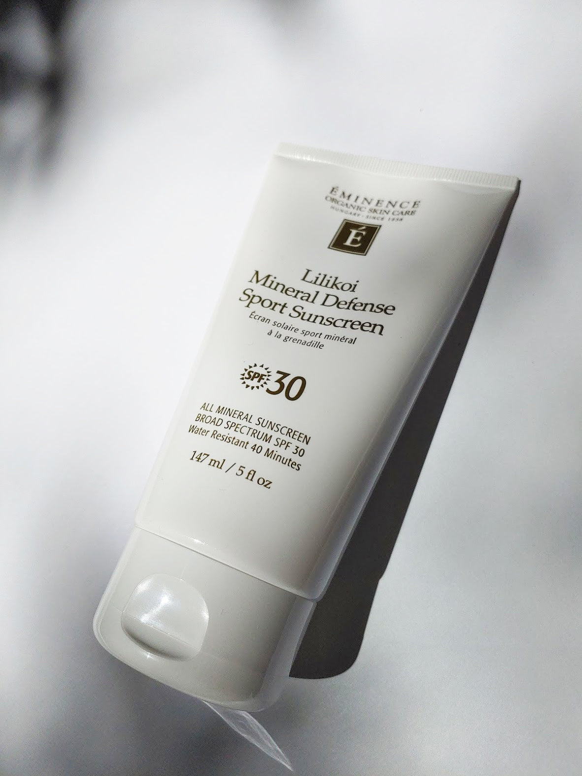a bottle of lilikoi mineral defense sport sunscreen spf 30 by Eminence
