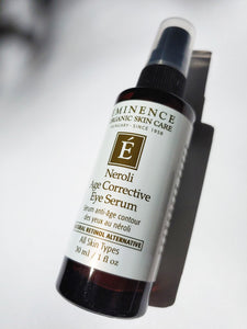 a bottle of neroli age corrective eye serum by Eminence - the bottle has a pump lid