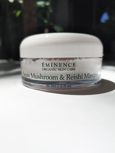 a jar of snow mushroom and reishi masque by Eminence. the jar is short and wide.