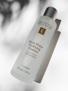a large bottle of birch water purifying essence by Eminence - for all skin types