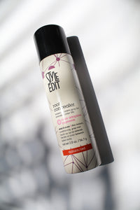 a bottle of style edit root concealer spray in auburn/red