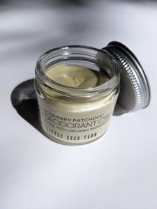 a small jar of cream deodorant. It is in a glass jar with a tin lid.