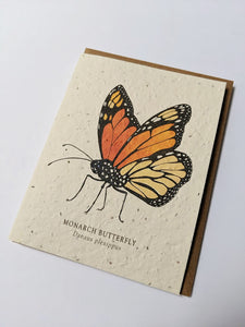 a plantable seed card - the card has a textured look from the seeds imbedded in the paper. There is a butterfly drawing on this one that says "Monarch Butterfly - Danaus Plexippus"