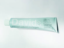 Load image into Gallery viewer, a tube of David&#39;s Natural Toothpaste. it says &quot;Premium Natural Toothpaste. Whitening, Antiplaque, Fresh Breath, Flouride Free, Sulfate Free. Peppermint essential oil blend&quot;
